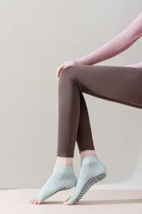 Open-toe five-toe yoga socks with non-slip silicone grip dots for women pilates fitness.