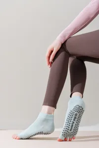 Non-slip open toe yoga socks with grip dots, breathable five-toe design for pilates.