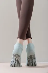 Detail view of non-slip yoga socks with silicone grip soles for pilates and indoor workout.