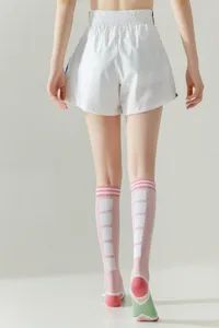 Women knee-high sports socks, stylish slim fit long socks for fashion daily wear and training.