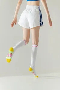 Detail view of stylish long sports socks for women, featuring knee-high design and comfortable fit.