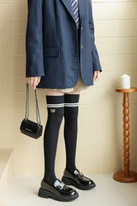 Japanese college style black over-the-knee socks with white double stripes and embroidery.