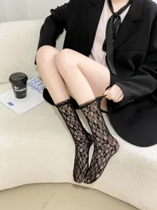 Women black lace sheer mid-tube socks, ultra-thin sweet ruffled Lolita hosiery for summer.