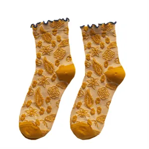 Ethnic style jacquard mid-tube socks for women with cute ruffled cuffs and cozy fit.