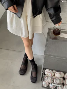 Black sheer ribbed women socks, lightweight summer transparent long hosiery for stylish daily wear.