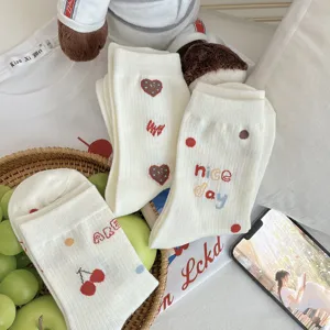 Cute Japanese style women crew socks with sweet heart and cherry prints for daily wear.