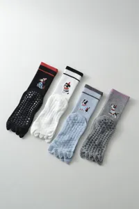 Women five-toe yoga socks non-slip silicone pilates sports socks with cute dog mid-tube.