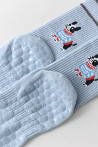 Light blue mid-calf yoga socks featuring cute dog pattern and anti-slip silicone soles.