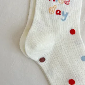 Cute Japanese style mid-tube women socks with colorful polka dots and cute letter embroidery details