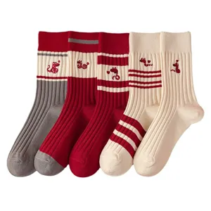 Year of the Snake red women's mid-tube knitted socks featuring cute embroidery and cozy knit.