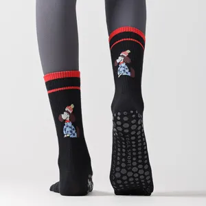 Cute cartoon dog black five-toe yoga socks with anti-slip silicone grip soles for women.