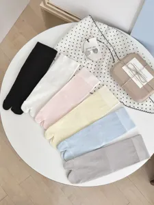 Summer thin split-toe socks detail view, neat flat lay multi-color tabi socks display.