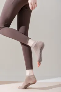 Open toe non-slip yoga socks with silicone grips for pilates, barre and fitness workouts.