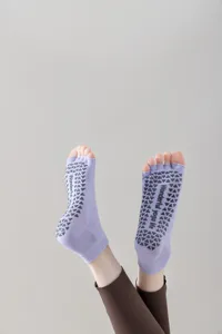 Open toe yoga socks with non-slip silicone grips, perfect for pilates and fitness workouts.