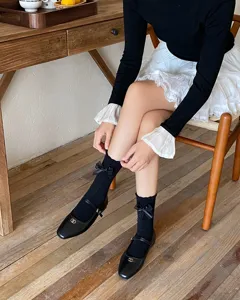 Cute women's mid-tube socks featuring delicate lace bows, perfect for sweet JK style daily wear.