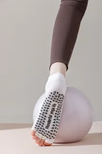 Non-slip yoga socks with open toes and grip soles, perfect for pilates and fitness workouts.
