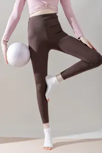 Detailed view of women's open-toe five-toe yoga grip socks with non-slip silicone soles.