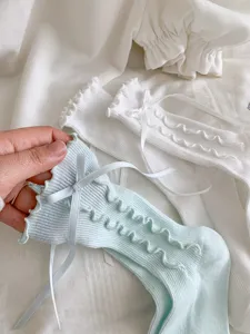 Sweet ruffle bow mid-tube socks detail view, perfect for daily cute outfits and cosplay.