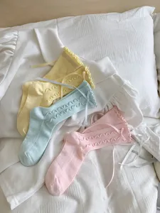 Sweet ruffles mid-tube women socks with cute ribbon bows, soft aesthetic daily wear style.