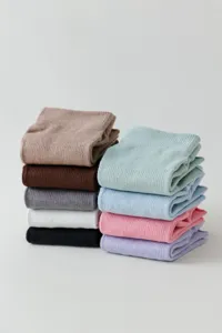 Detailed view of multi-color ribbed knit socks neatly folded and stacked together.