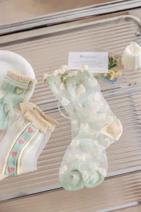 Sheer mesh ruffle socks for women, cute floral and heart pattern summer thin tube socks.