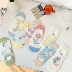 Close-up detail of cute summer mesh low-cut socks with floral embroidery, breathable and non-slip.