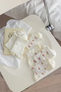 White cute ruffle mid-calf socks detail, sweet strawberry and bow knit pattern design.