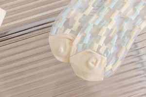 Detailed view of sheer mesh summer socks with cute blue and yellow check pattern design.