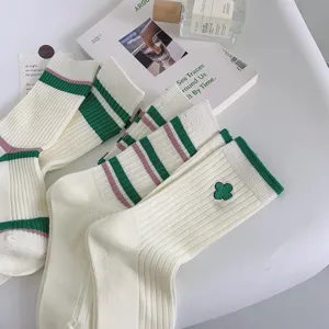 Green striped mid-tube women socks, cozy knit slouch socks with clover embroidery detail.