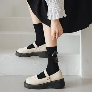 Chaussettes mi-hautes noires de style Lolita japonaise avec nœuds élégants et perles pour femmes.
