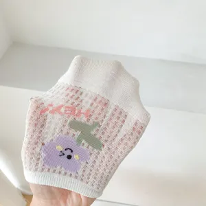 Detail close-up view of women's summer breathable mesh short socks with cute floral pattern.