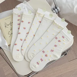 Cute white mid-tube socks with sweet strawberry, bow and daisy embroidery for women.