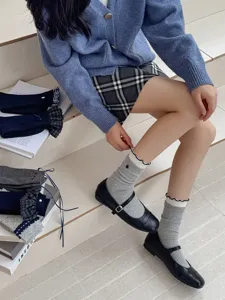 Detailed view of grey ruffled mid-tube socks, breathable cotton knit, Korean ins style.