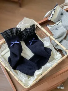 Women sweet knitted long socks featuring plaid ruffles and ribbon bows daily detail.