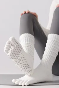 White five-toe grip yoga socks, long anti-slip pilates socks for women comfort wear.