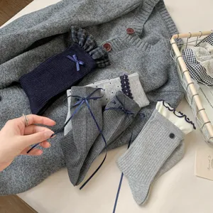 Womens stylish blue gray mid tube socks with cute bows and lace ruffles for daily wear