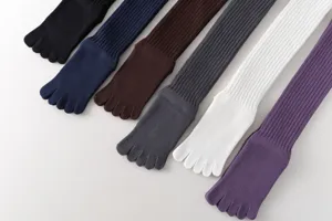 Detailed view of long ribbed five toe socks in various colors close up knit fabric design