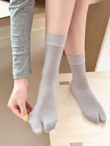 Detail view of ultra-thin grey split-toe women socks, showing toe details and fabric texture.