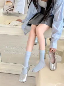 Detail view of summer light blue split-toe socks featuring Japanese tabi style and soft texture.