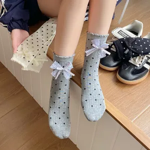 Sweet grey polka dot mid-calf socks with cute lace bows, cozy JK style everyday hosiery.