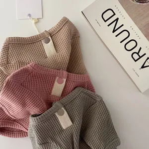 Detailed view of soft waffle pet shirt for small dogs and cats, cozy autumn winter apparel.