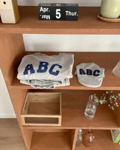 Cozy grey matching pet and owner sweatshirts with classic embroidered ABC letters for daily wear.