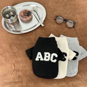Detailed view of cozy autumn pet sweatshirt with letter embroidery for small dogs and cats.