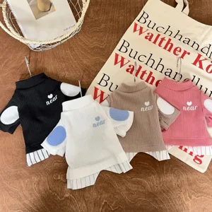 Detailed view of cute pet knit sweaters featuring fake two-piece design and cozy fabric.