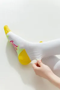 Detailed view of women's long athletic sports socks showing stretchable knit texture.