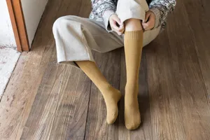 Cozy yellow long winter socks for women, thick terry knit vintage knee-high socks.