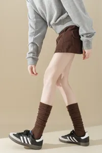 Ribbed knit tall socks detail shot, cute college style winter stacked socks for women.