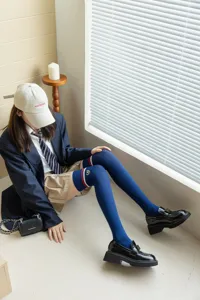 Detailed view of women's long over-the-knee JK socks featuring ribbed knit and stripe design.