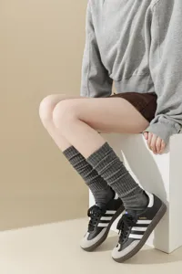 Grey ribbed knee high socks for women, thick knit cozy leg warmers for autumn winter.