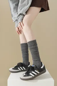 Knit slouch socks for women, thick cozy boot socks, winter vintage casual hosiery detail.